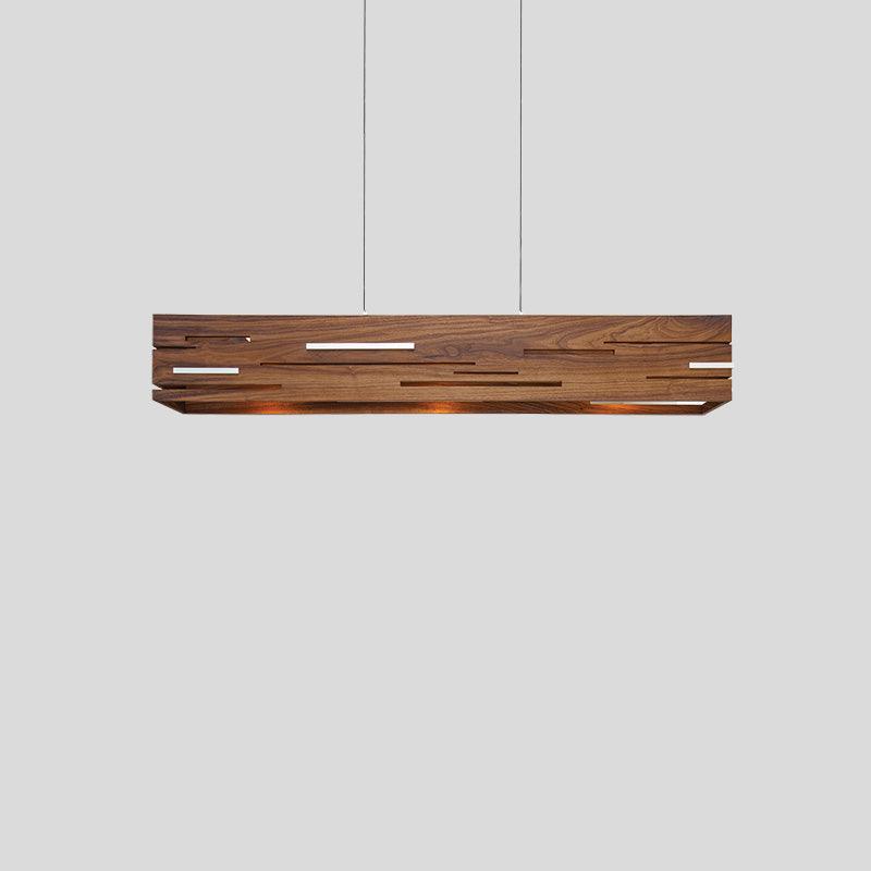 Aeris linear pendant chandelier in natural walnut wood with glowing light slits.