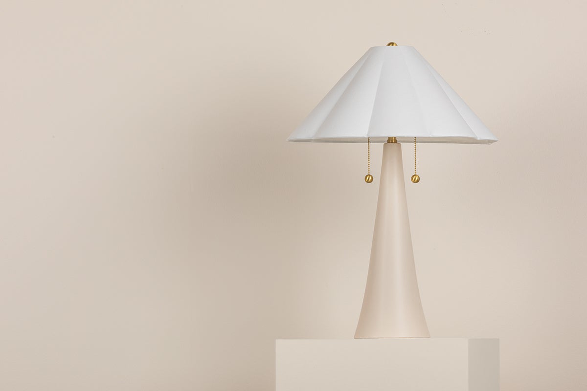 Alana ceramic table lamp with a white scalloped linen shade and brass pull chains.