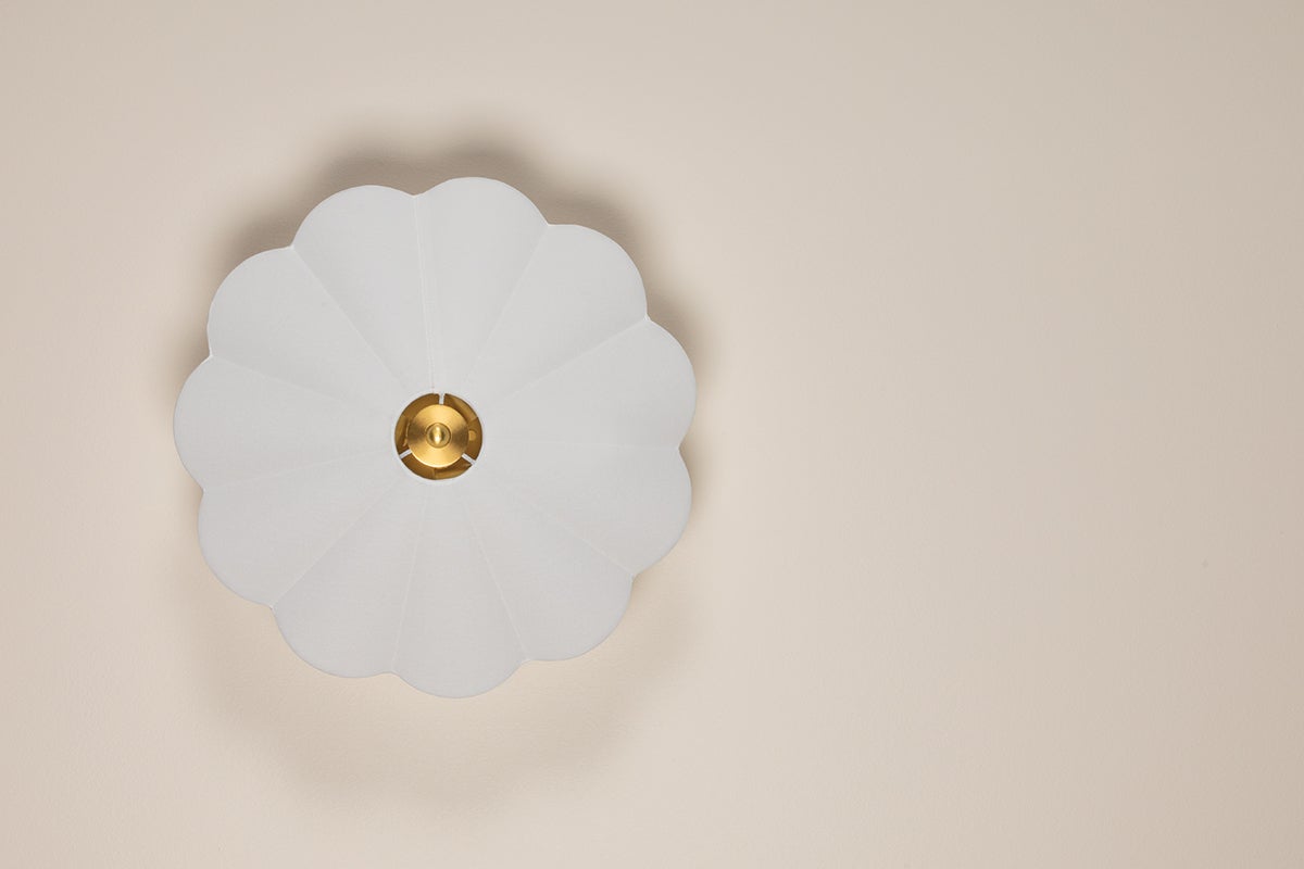 Alana semi-flush ceiling light with a scalloped white linen shade and aged brass center accent.