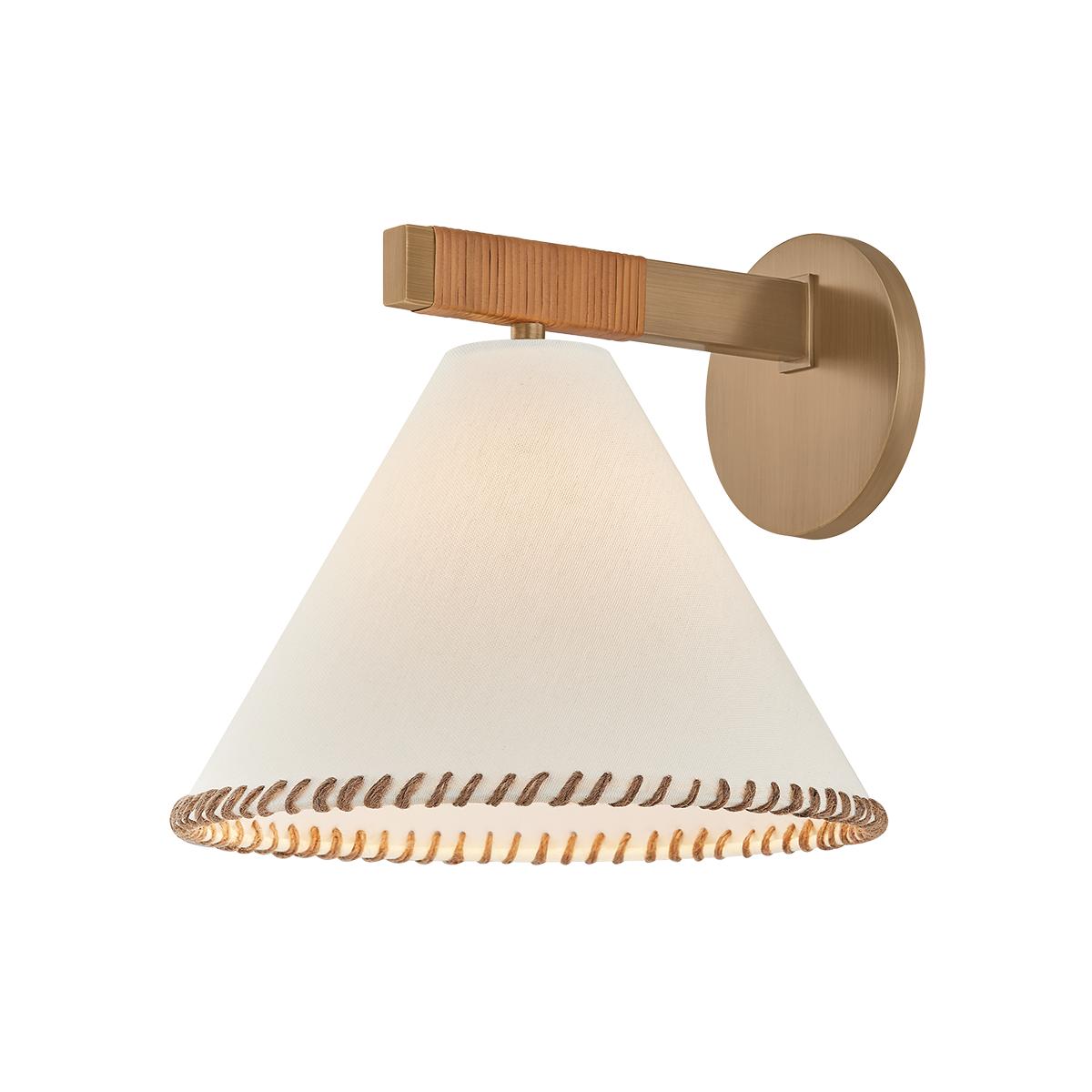 Stonely wall sconce with brass frame, jute wrap, and white linen shade with whip-stitching.
