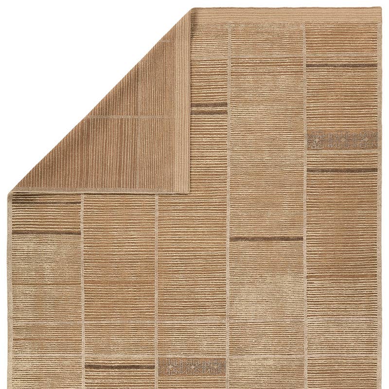 Bezem hand-knotted wool rug in beige and brown with a textured geometric grid pattern.