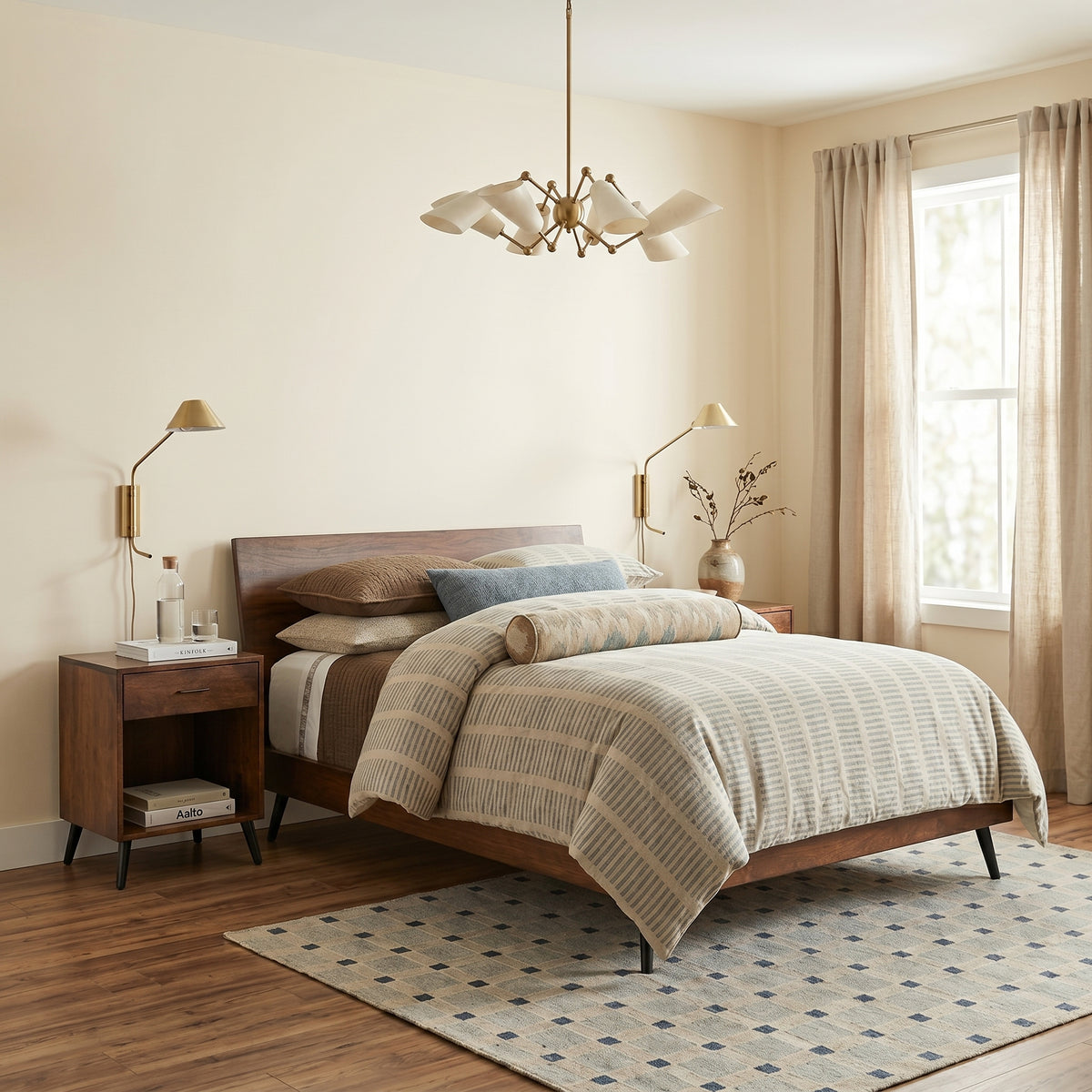 Bergen midcentury walnut 1-drawer nightstand with tapered legs next to a matching bed.
