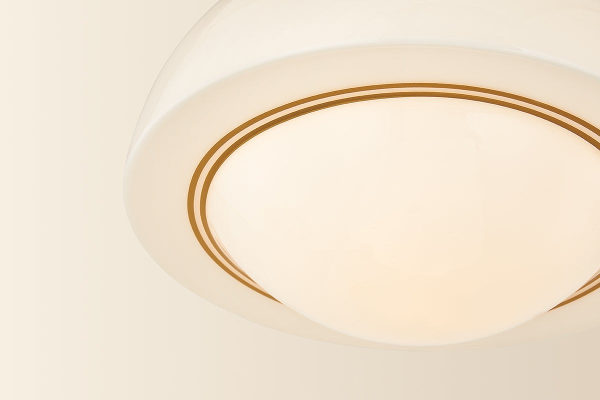 Celine semi-flush ceiling light with a domed opal glass shade and gold pinstripes.