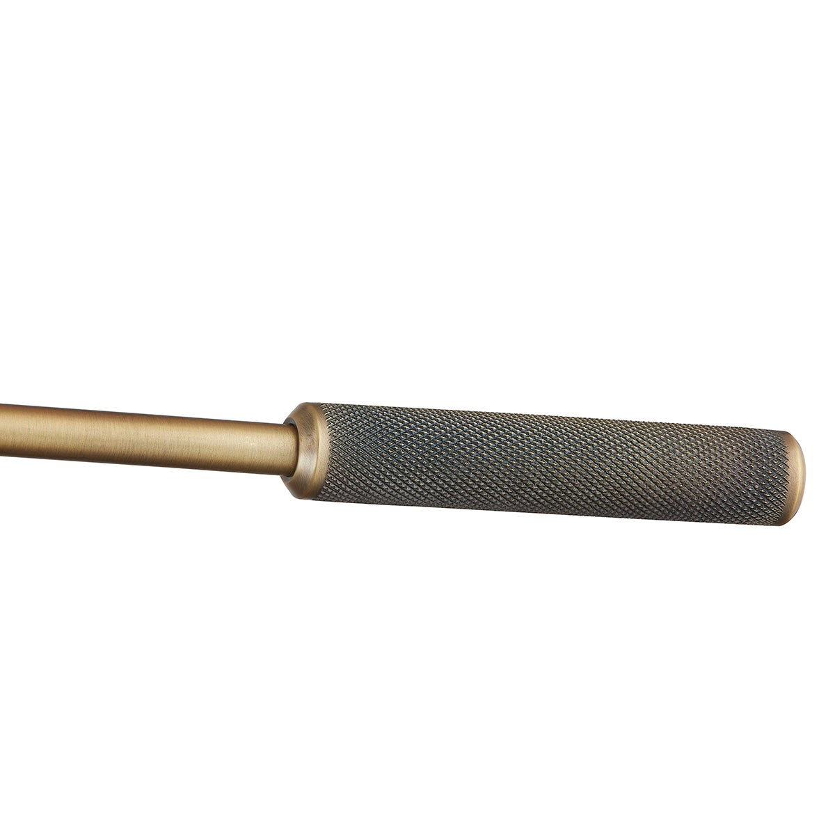 Close-up of the textured knurling on the patina brass handle of the Cannon wall lamp.