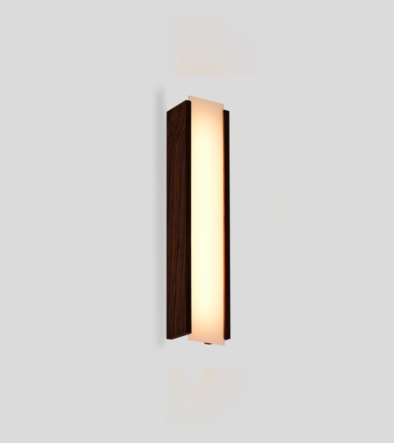 Modern Capio walnut wood wall sconce with a glowing warm LED light panel.