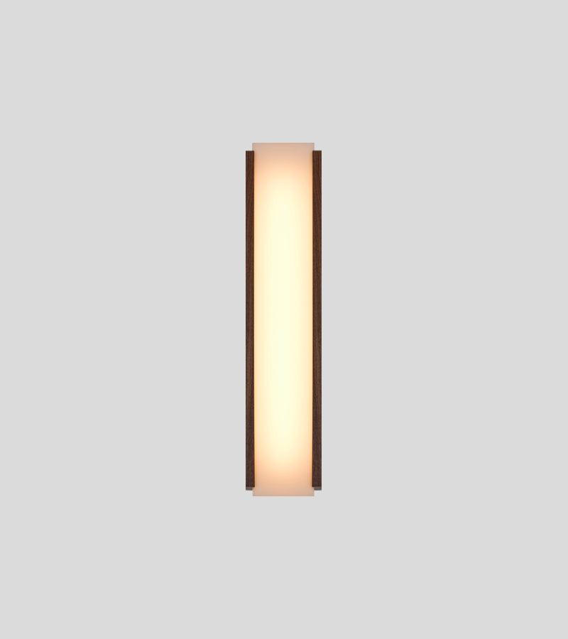 Capio walnut wood wall sconce with glowing warm LED light panel