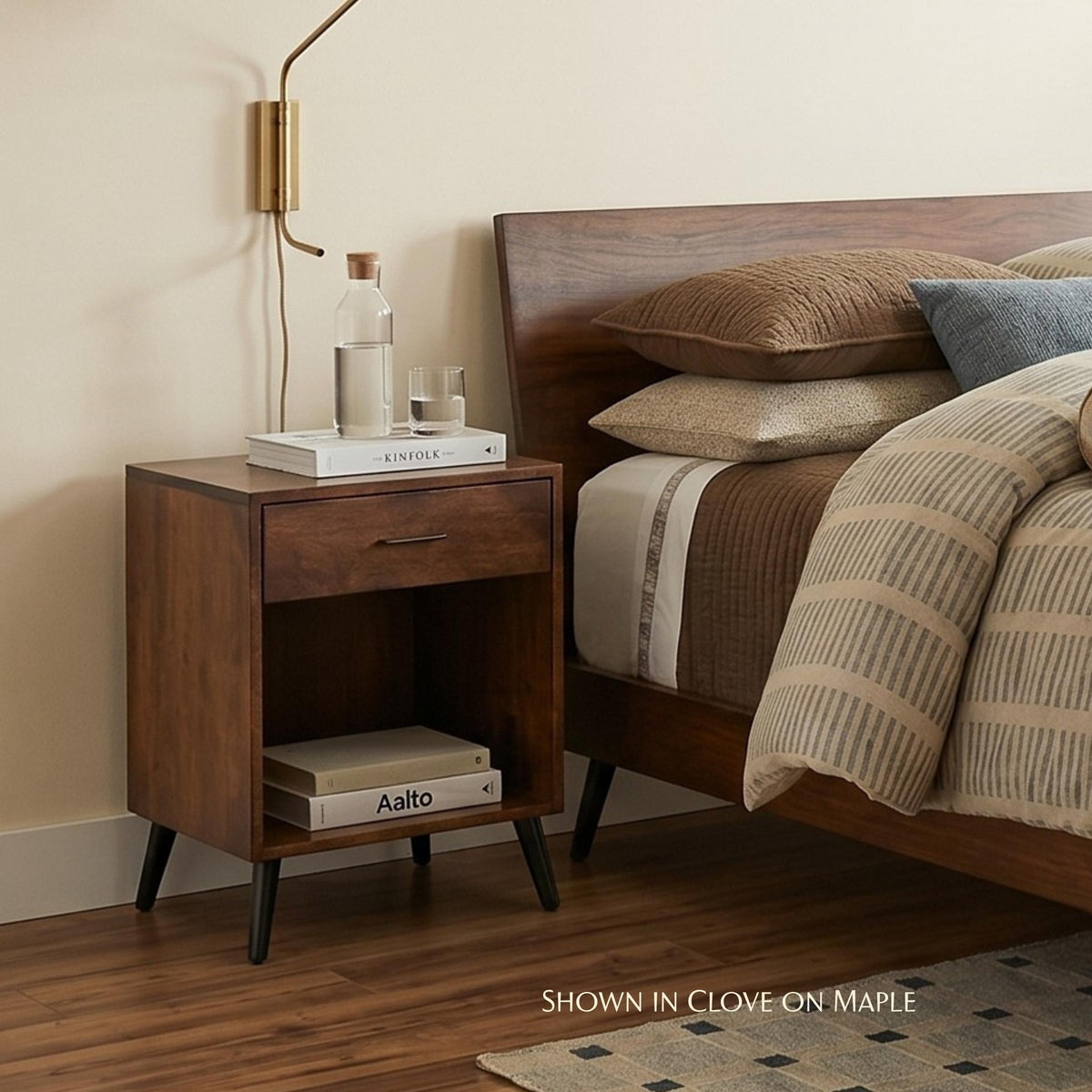 Bergen midcentury 1-drawer nightstand in clove on maple wood next to a bed