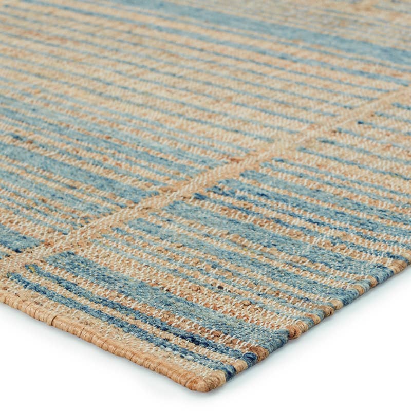 Dorada hand-woven wool and jute rug featuring blue and natural tan textured stripes.