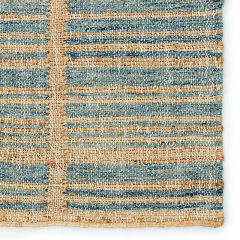 Dorada hand-woven wool and jute rug featuring a blue and natural tan textured stripe pattern.