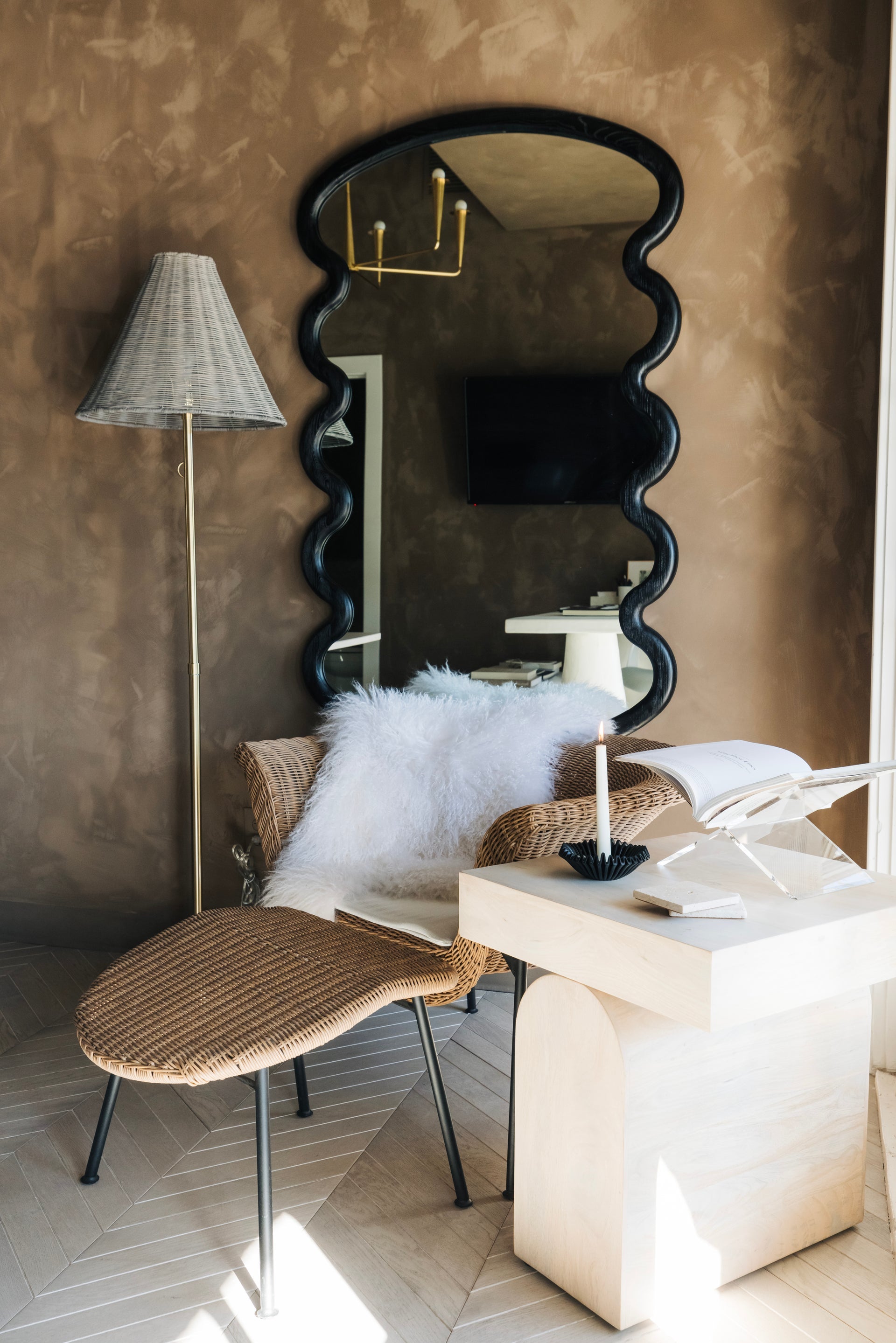 Destiny Floor Lamp with brass stem and gray wicker shade in a coastal style room.