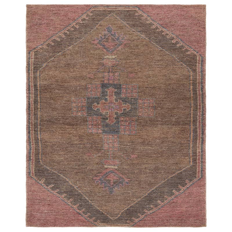 Elaida hand-woven rug in brown and muted pink with a traditional geometric medallion design.