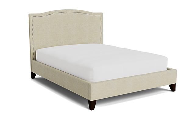 Elise beige upholstered bed with nailhead trim headboard and espresso wood legs