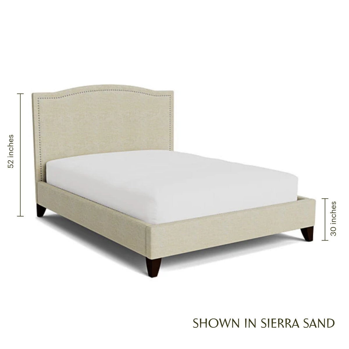 Elise upholstered bed in Sierra Sand with nailhead trim and espresso legs.