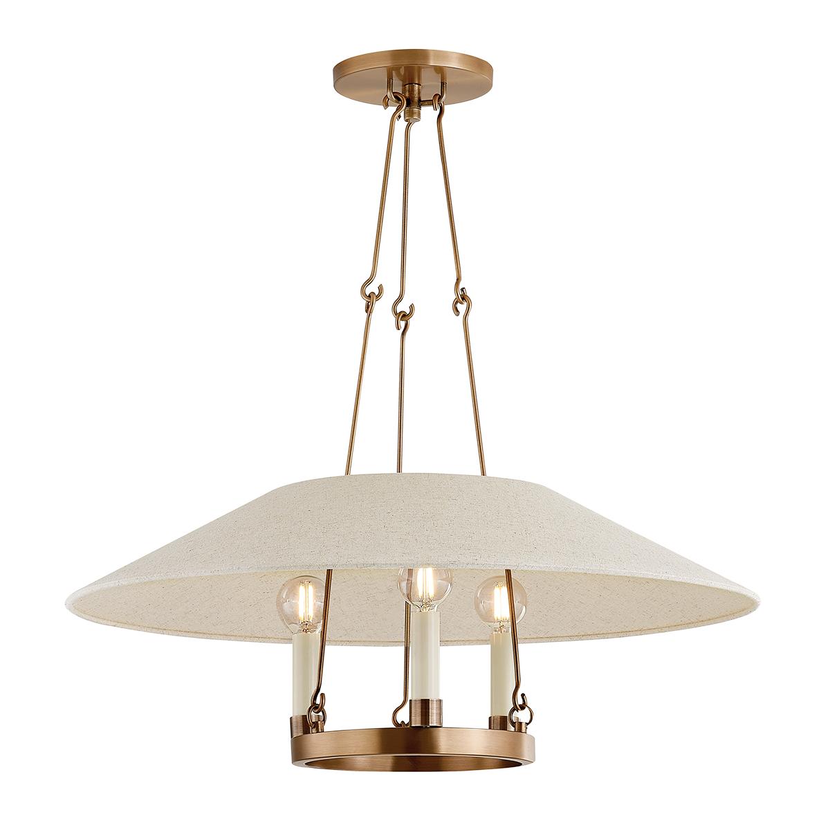 Archive Chandelier in patina brass with a cream linen shade and candle-style lights.