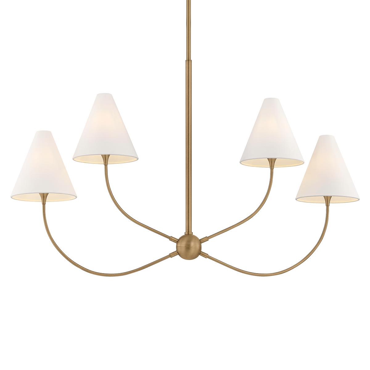 Evermore brass chandelier with four arcing arms and tapered white linen shades.