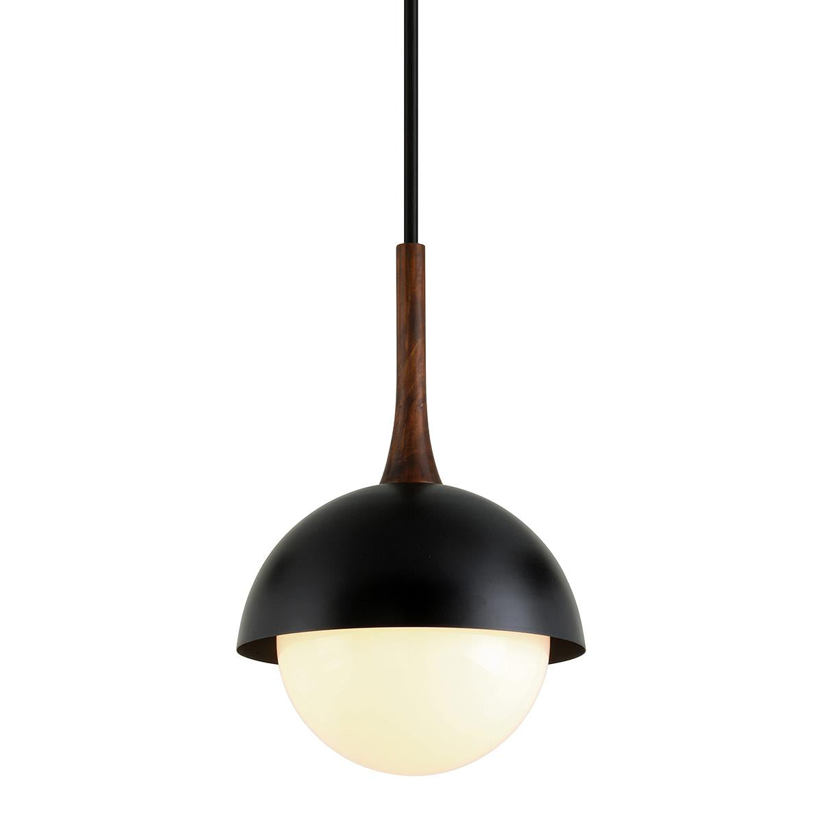 Cadet pendant light with black steel dome, wood neck, and glowing opal glass shade.