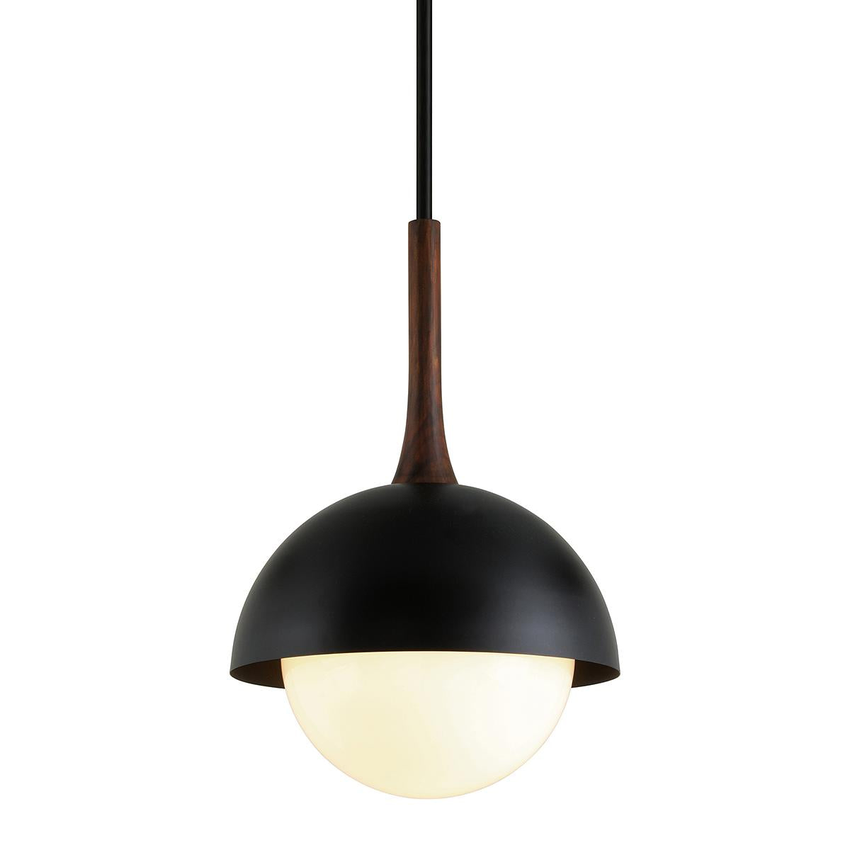 Cadet pendant light with black steel dome, wood neck, and glowing opal glass shade.
