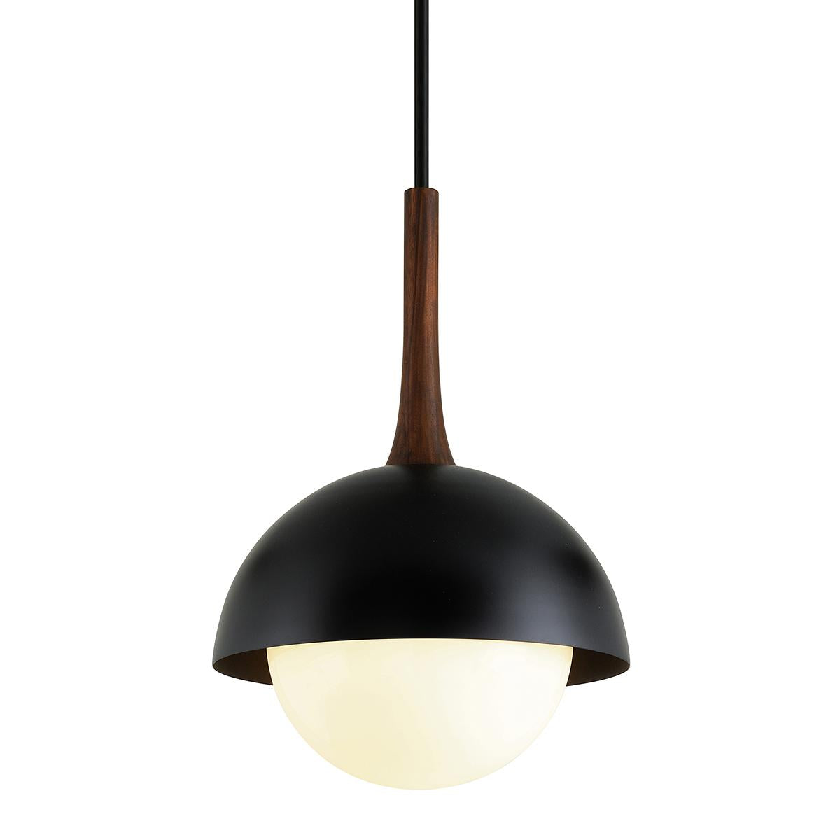 Cadet pendant light with a black dome shade, walnut wood accent, and glowing opal glass globe.