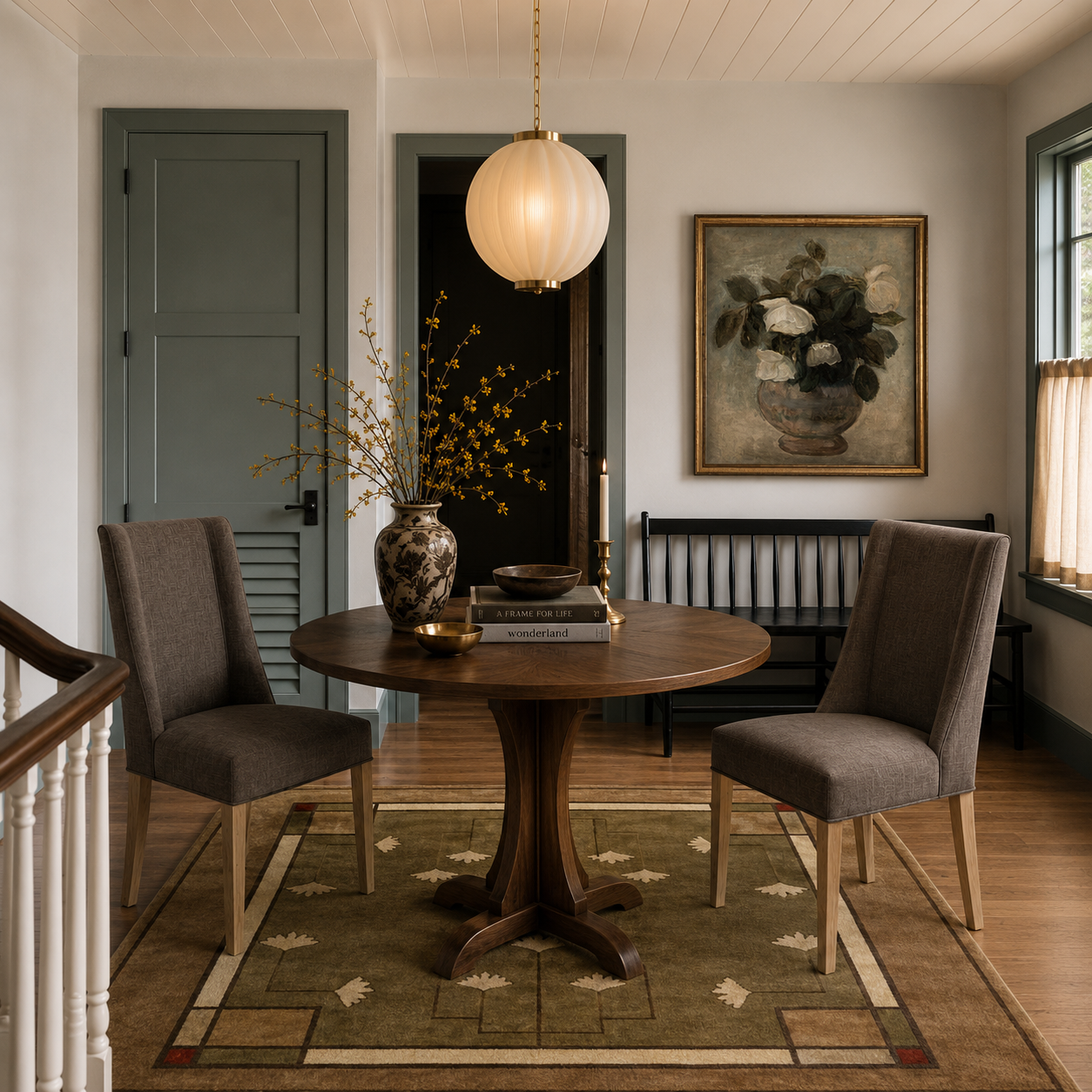 Ginkgo Sage hand-knotted wool rug with botanical patterns in a dining room.