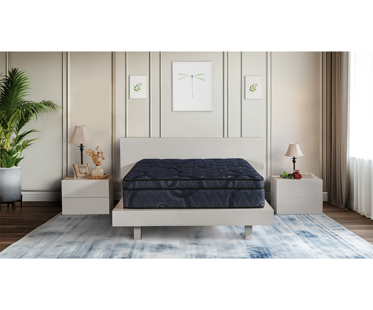 Opulence 13-inch dark blue Eurotop mattress on a modern white bed frame