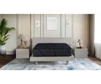 Splendor Mattress in dark blue quilted fabric on a modern light grey bed frame.