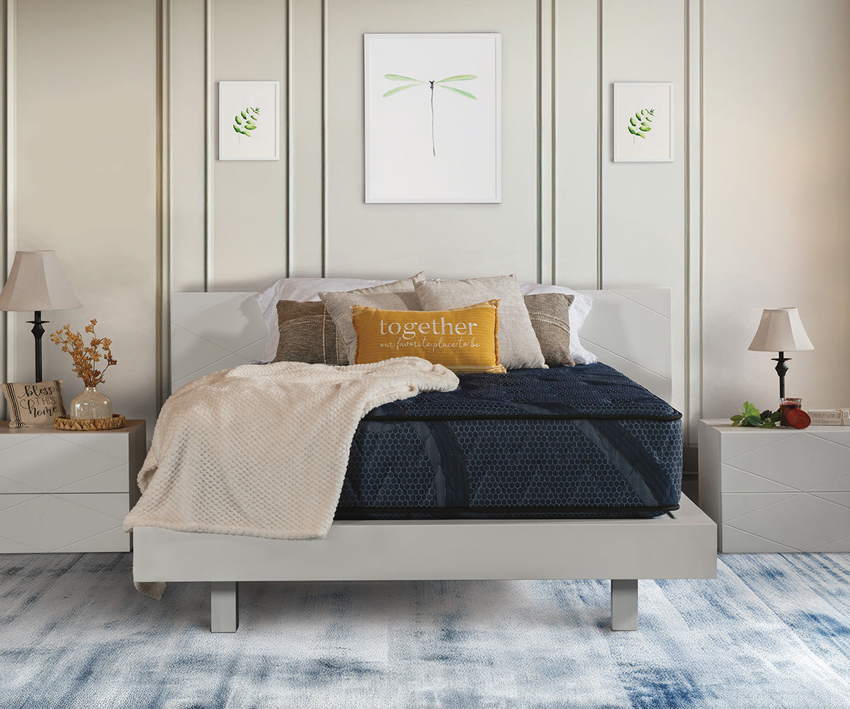 Splendor dark blue quilted mattress on a modern white platform bed frame