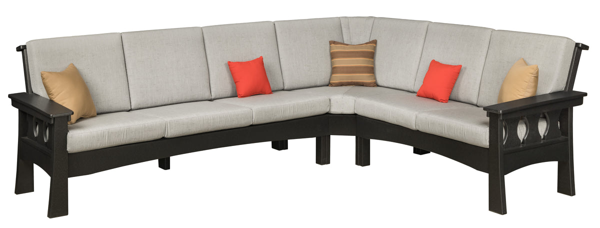 Craftsman outdoor sectional in black poly lumber with grey cushions and accent pillows.