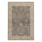 Liberty Hand Knotted Rug in muted grey and beige wool with a traditional floral pattern and fringed edges.