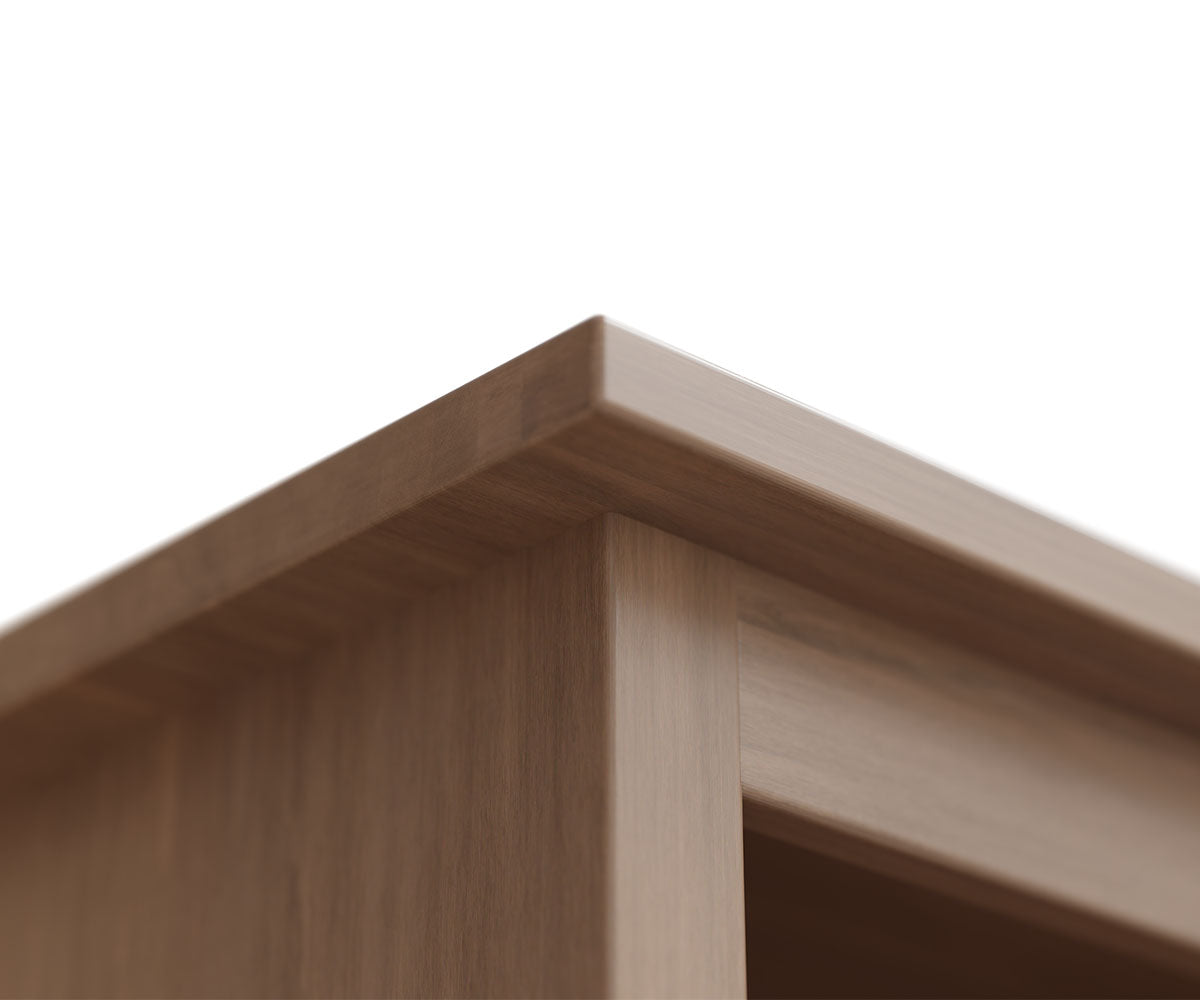 Close-up of the top corner of a brown hardwood Lamont bookcase with a smooth finish.