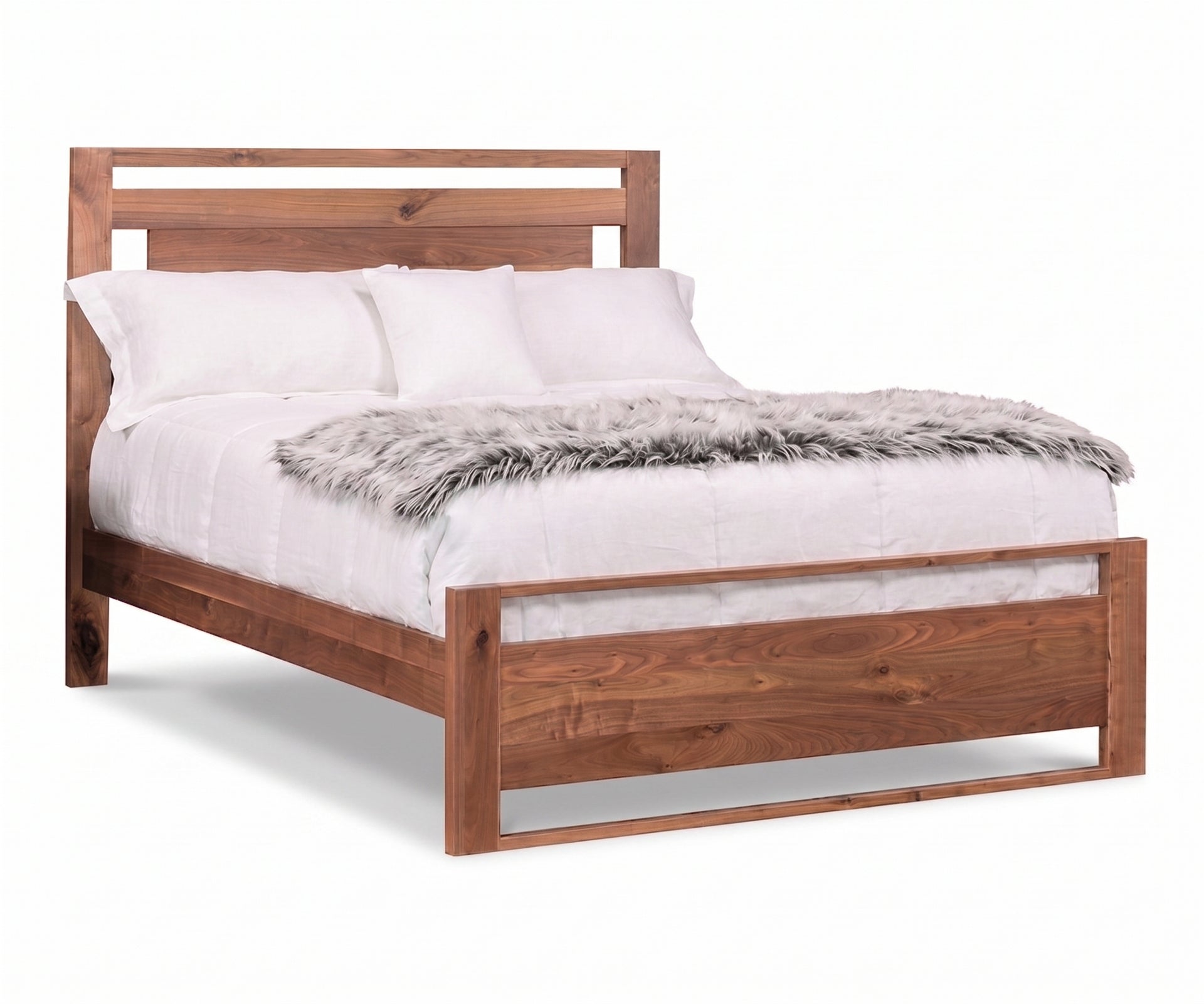 Logan solid walnut panel bed with white bedding and a grey faux fur throw.