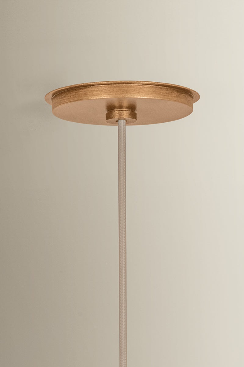 Patina Gold Leaf ceiling canopy and woven cord of the Louise pendant light.