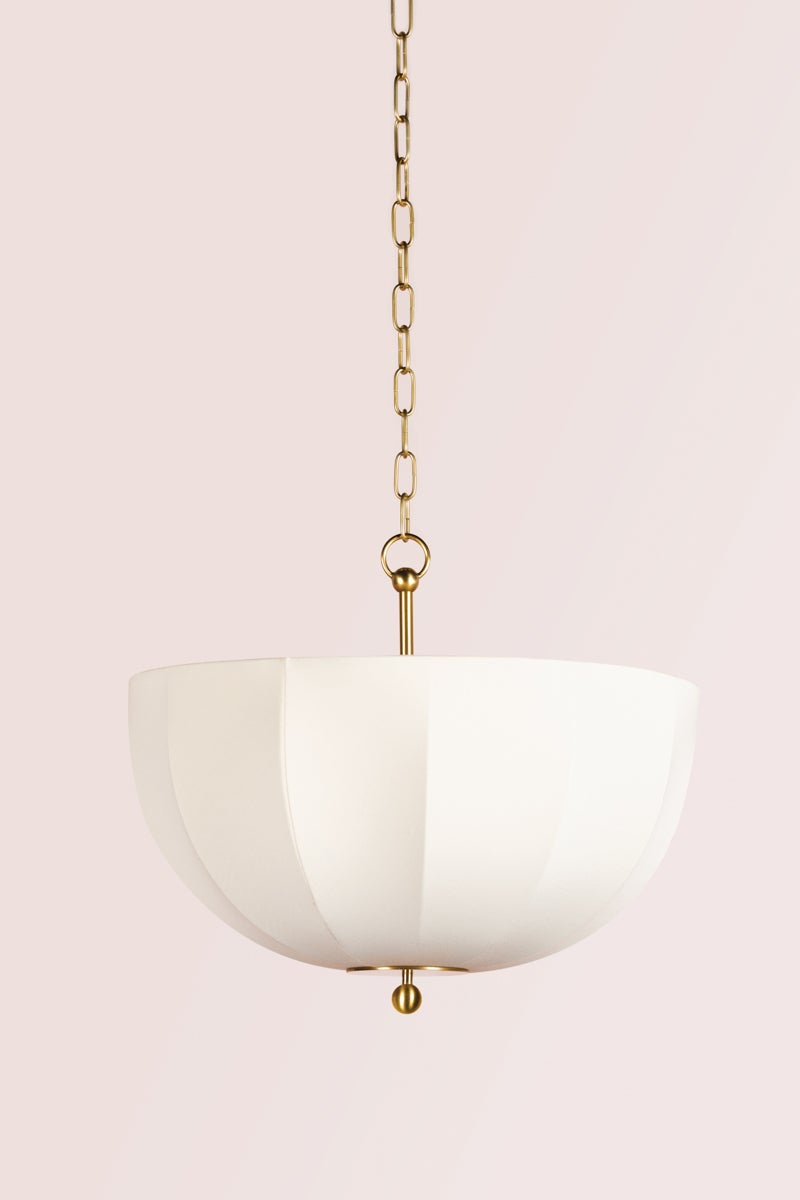 Meshelle pendant light with a white umbrella-shaped fabric shade and aged brass chain.