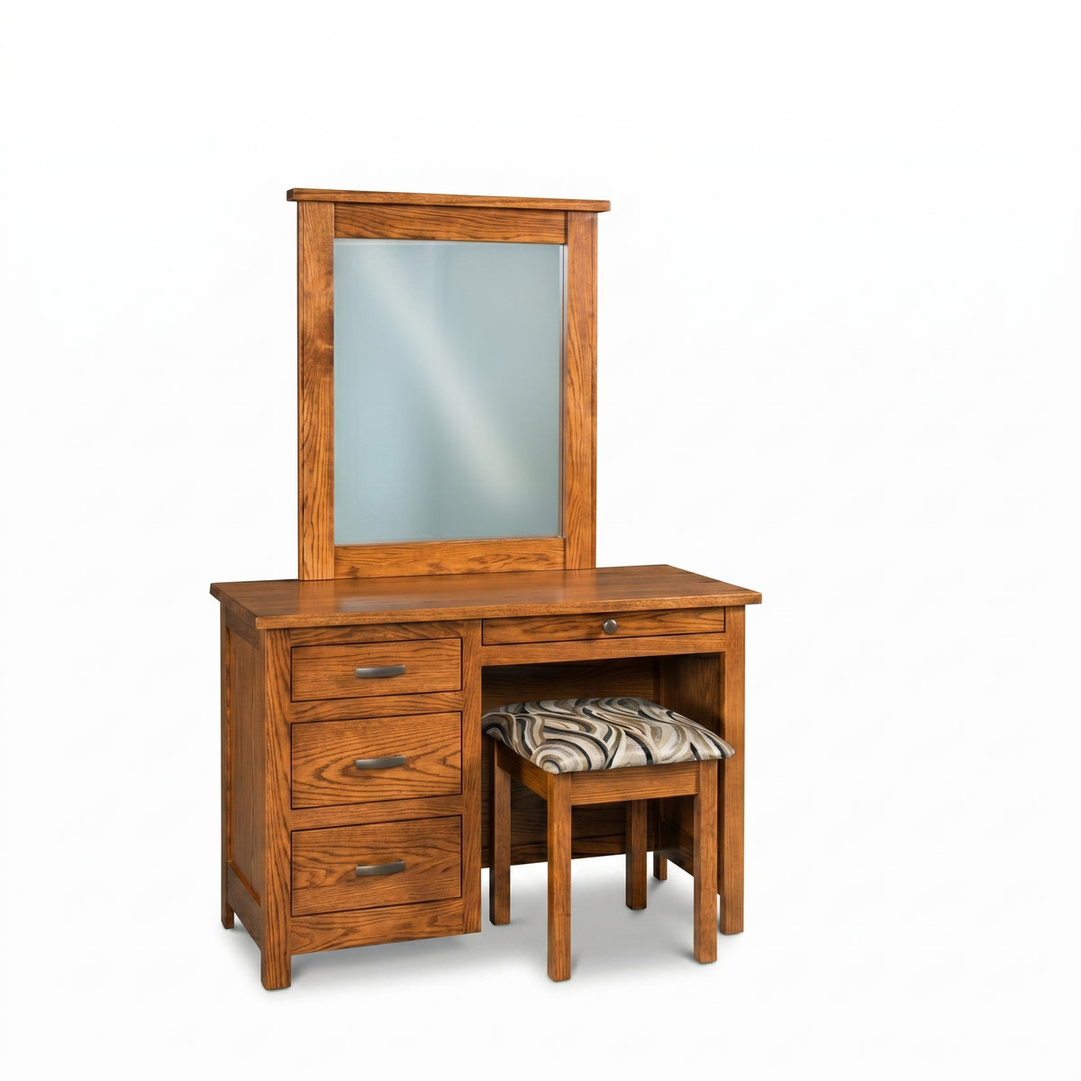 Mission oak vanity set with mirror, four drawers, and a patterned cushioned stool.