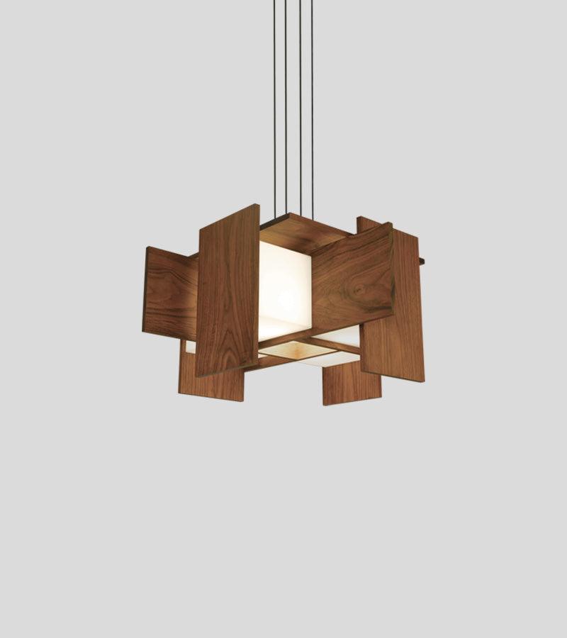 Muto pendant chandelier with floating walnut wood panels and glowing warm LED light.