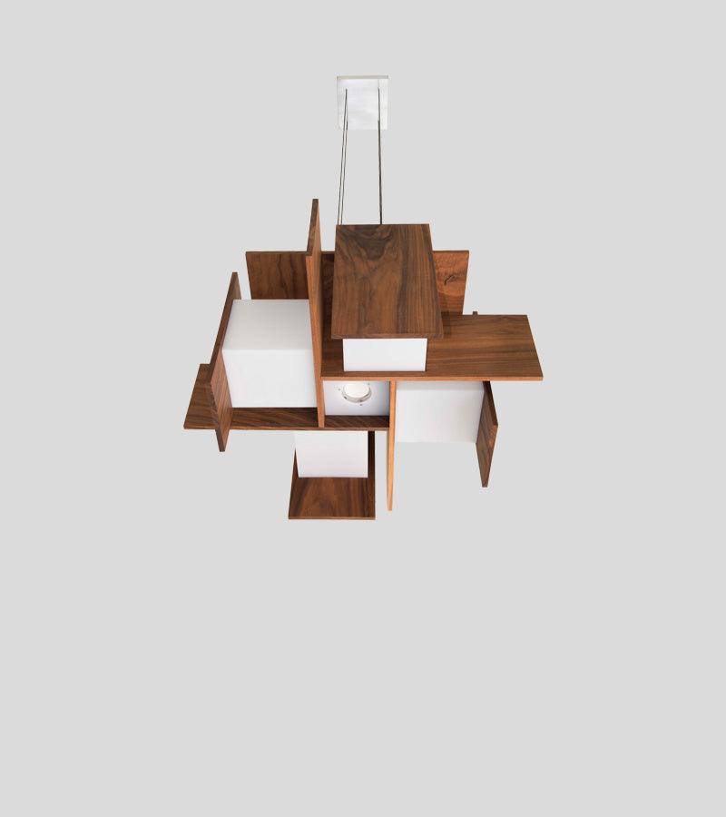 Muto pendant chandelier with floating walnut wood veneer panels and white diffusers.