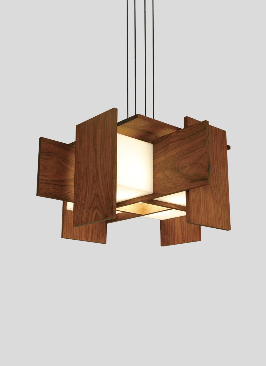 Muto pendant chandelier with floating walnut wood panels and glowing warm white LED light.