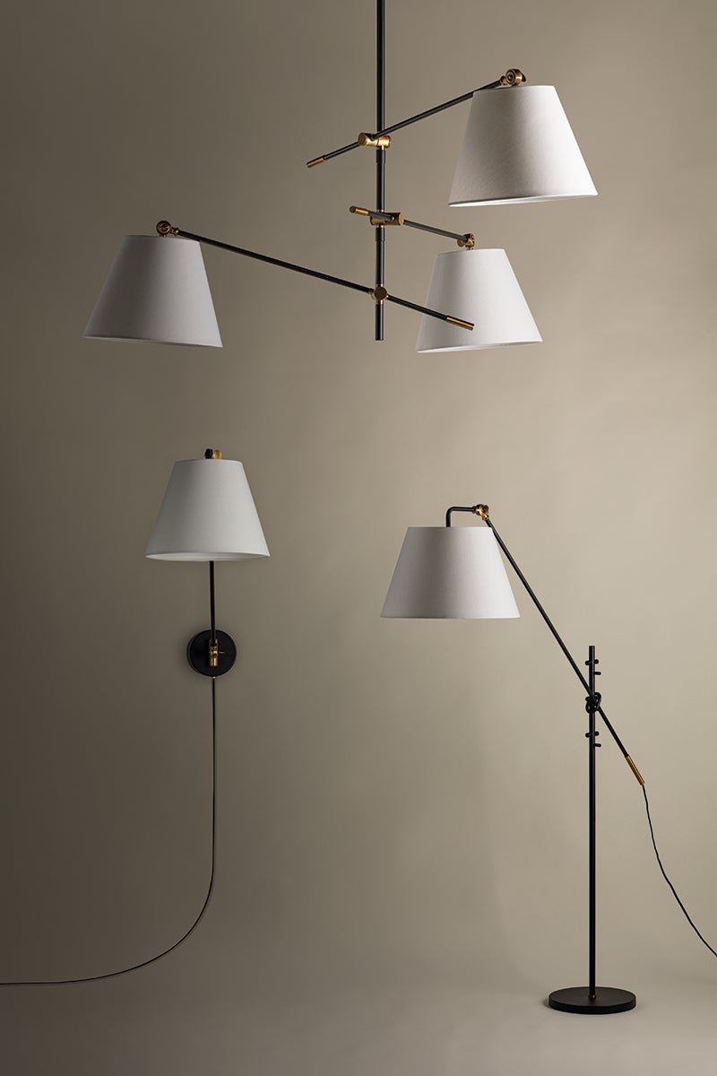 Navin black and brass chandelier, wall sconce, and floor lamp with white linen shades