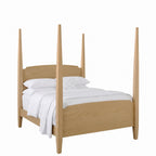 Nouvelle light oak four poster bed with white bedding and pillows.