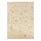 Orenda hand-knotted wool rug with muted floral patterns on a cream background.