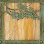 Evergreen filigree wall mount in verdigris patina with gold white iridescent glass.