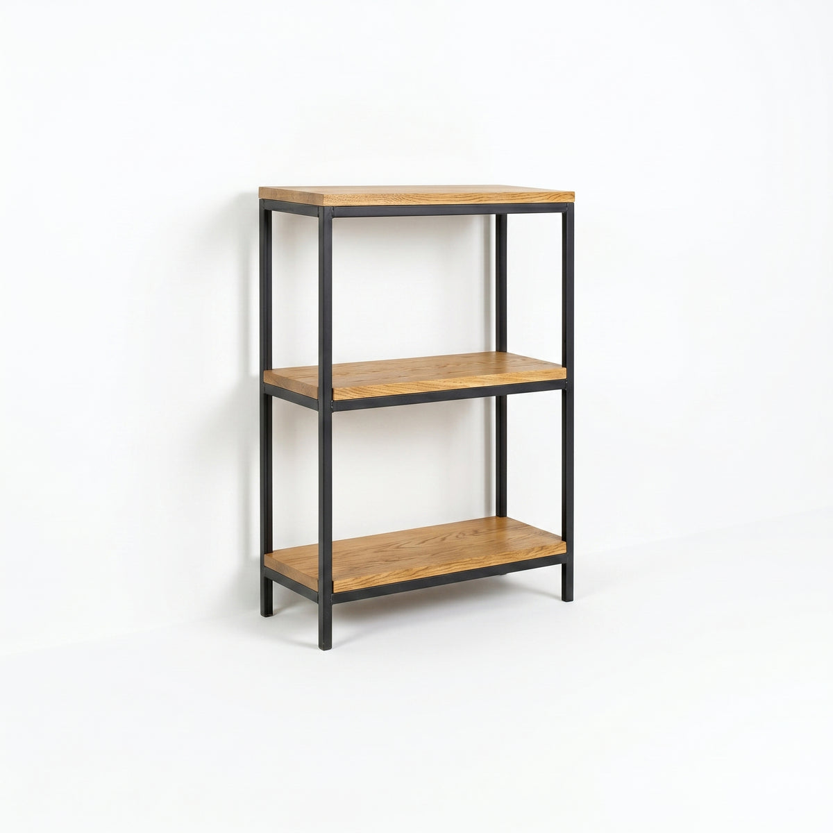 Omni Bookcase with three natural wood shelves and a black metal frame.
