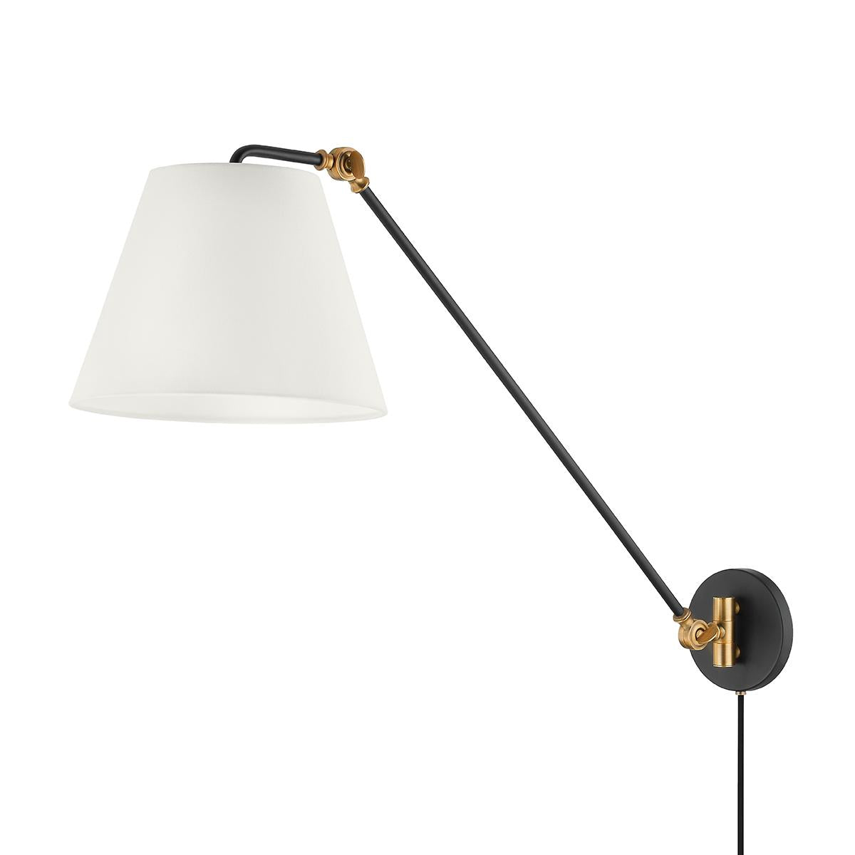 Navin plug-in wall sconce with a black adjustable arm, brass accents, and a white linen shade.