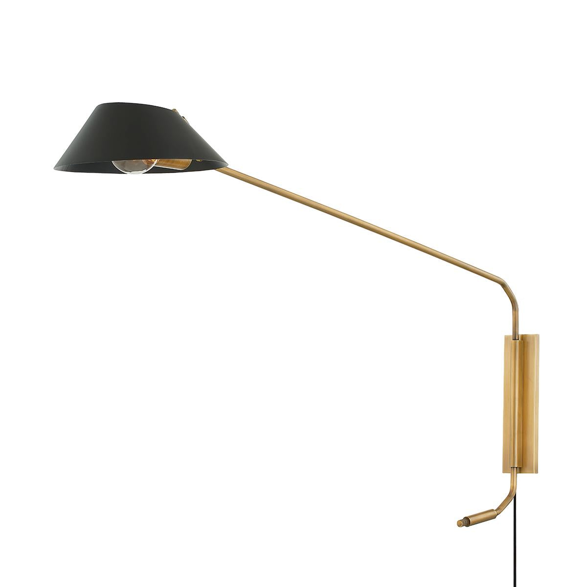 Sacramento plug-in wall sconce with a long brass arm and a matte black metal shade.