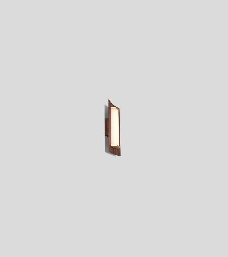 Penna Sconce in solid walnut wood with a glowing LED light panel and brass accents.