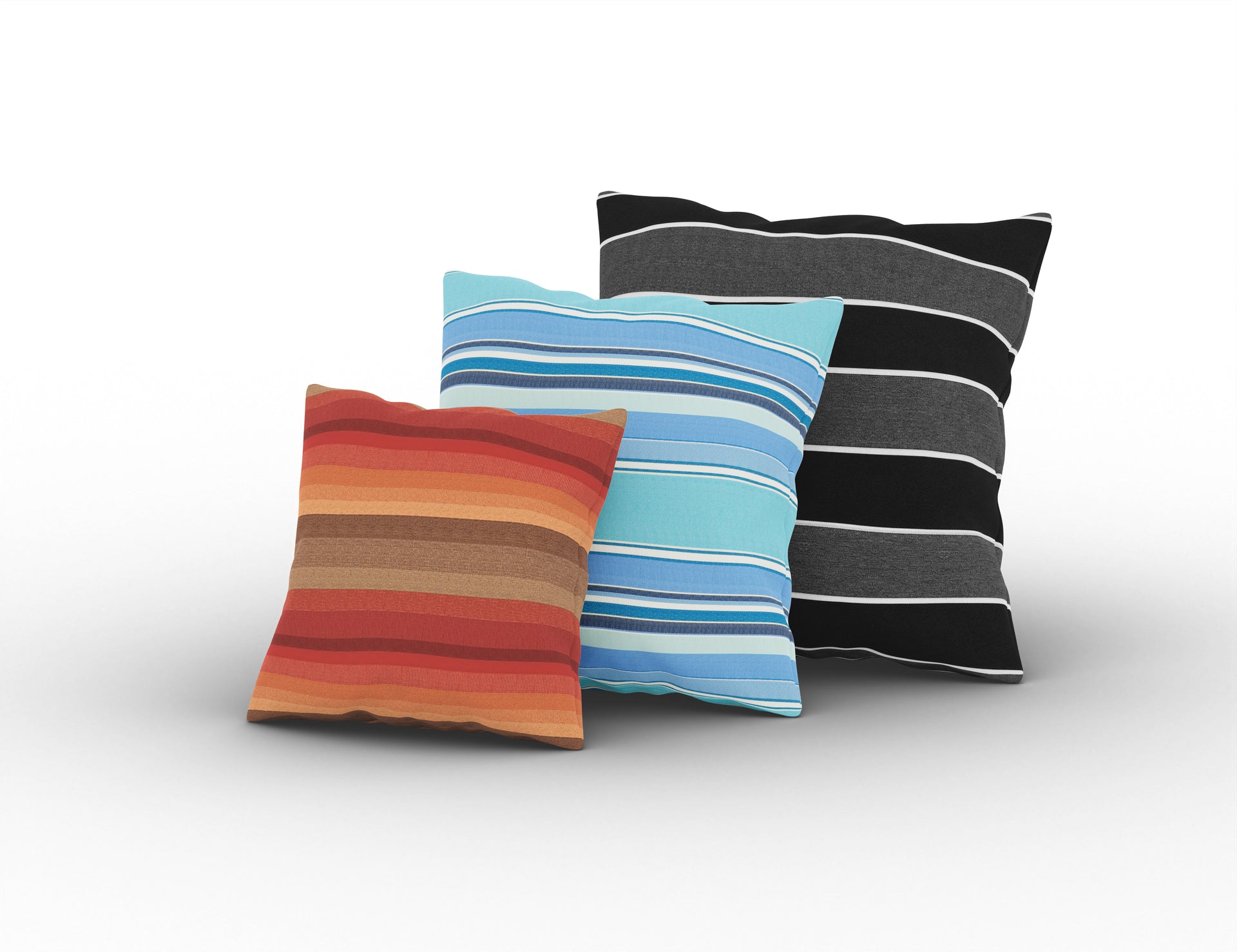 Three Sunbrella outdoor throw pillows in striped orange, blue, and black patterns.