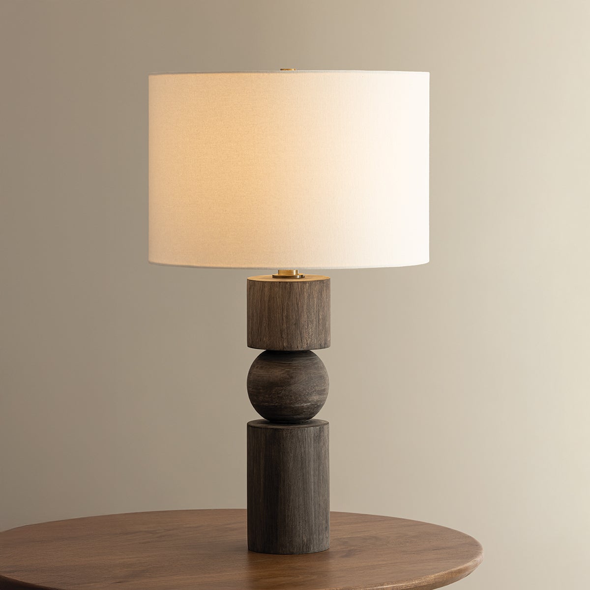 Ralston table lamp with a stacked mango wood base and white linen drum shade.