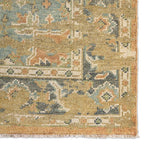 Rhapsody orange hand-knotted wool rug with muted blue and green traditional patterns