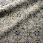 Rhapsody hand-knotted wool rug with a muted brown and grey geometric medallion pattern.