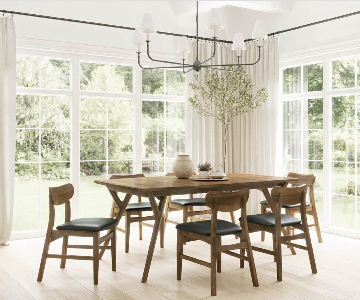 Wilton wooden dining chairs with black leather seats around a matching wood table