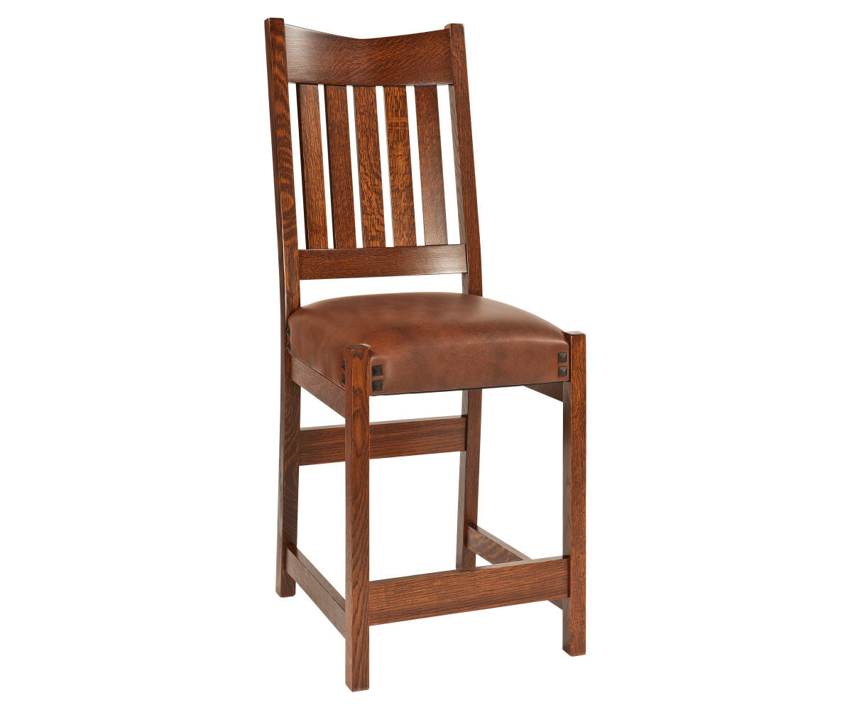 Conner Amish bar chair in dark oak wood with a brown leather cushioned seat.